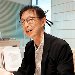安達賢二